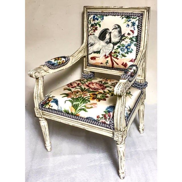 This charming French child’s bergere chair is upholstered in a vintage chintz that has some sort of coating to it. The...