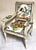 This charming French child’s bergere chair is upholstered in a vintage chintz that has some sort of coating to it. The...