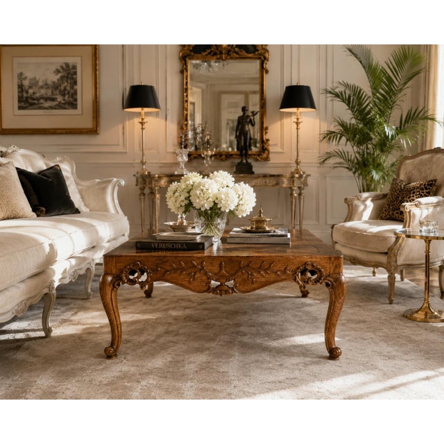 Elegant 1960s French Provincial coffee table crafted in oak with a beautifully aged warm finish. The substantial square...