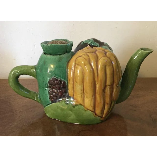 Antique 19th c. Chinese porcelain tea pot in famille vert glaze. The body of the pot is made up of three vegetables or...