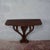 A refined vintage carved wood wall console table, an elegant antique piece ideal for entryways or hallways. This piece...