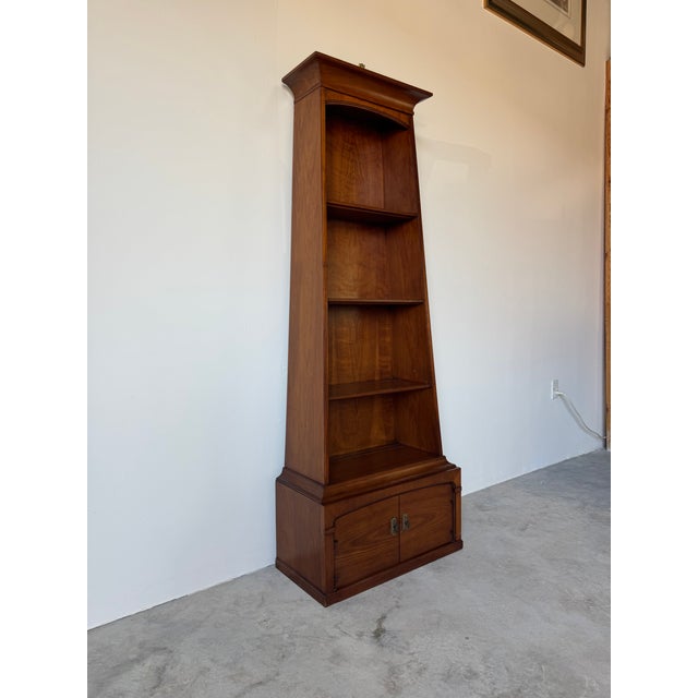 Elegant vintage bookshelf by Drexel, dating to the 1980s, crafted from solid wood with a warm, rich finish and beautifully...