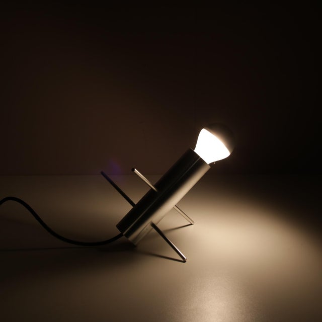 A beautiful “Krekel” (“Cricket”) table lamp designed by Otto Wasch, manufactured by Raak in the Netherlands in the 1960s....