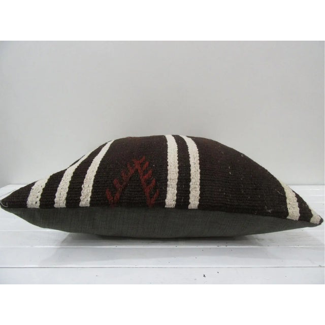 This is a pillow cover made from a vintage kilim rug. The piece was properly washed and ready to use. Pillow inserts not...