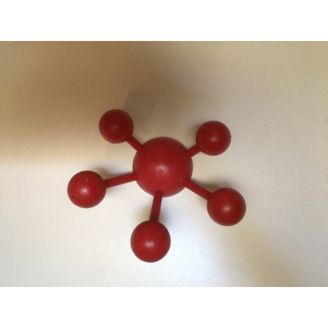 Contemporary style red wall hook looks like an atom Great to hang clothes, bags, hats, toys, etc dry wall anchors and...