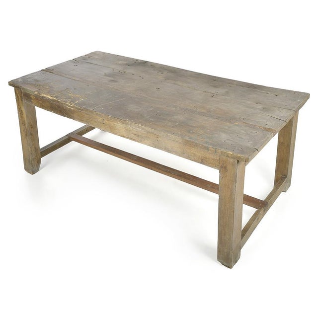 This long antique table commands an authentic presence and patinated appearance. Made entirely of solid wood, it features...