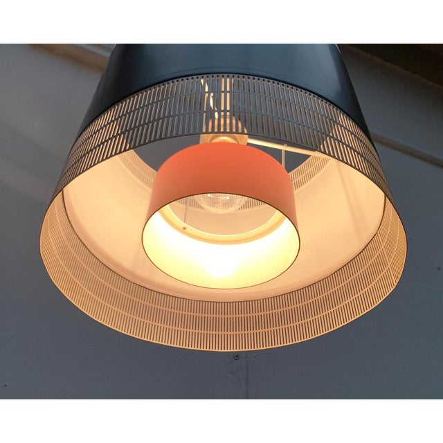 Very rare pendant lights from the renowned manufacturer staff. a minimalist design. The lamp body forms a filigree...