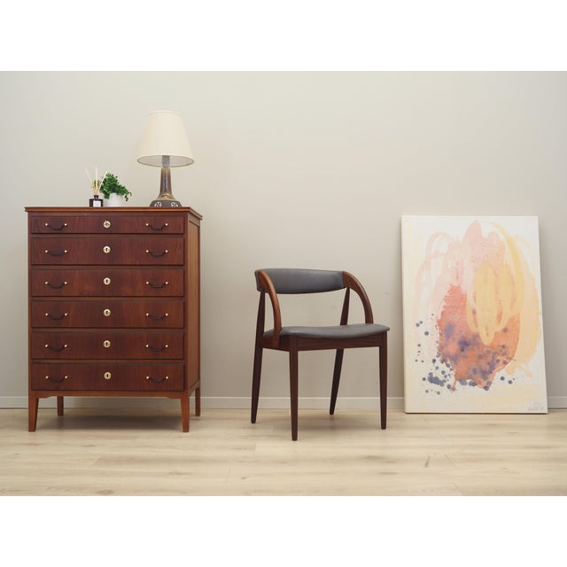 The chest of drawers was made in the 1970s, Danish production. The structure is covered with teak veneer. The legs are...