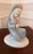 Beautiful vintage German porcelain figurine depicting the Madonna tenderly holding the Christ Child. Rendered in a serene...