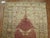 A decorative subtle colored Turkish runner depicting four lions in between a central medallion motif and multiple borders....