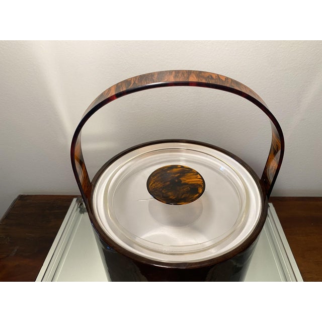 Fun vintage George Briard vinyl ice bucket in tortoise shell pattern. Measures about 7.5" across the top and about 7.5"...