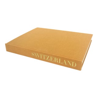 1972 Switzerland Turmeric Coloured Linen Hard Cover Coffee Table Book With Dust Jacket For Sale