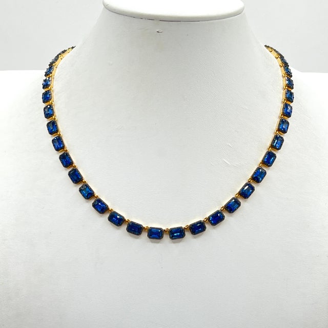 Gorgeous 27.35 ct. blue sapphire emerald cuts. Total of 44 stones. Handmade in 18k yellow gold and black rhodium. Length...