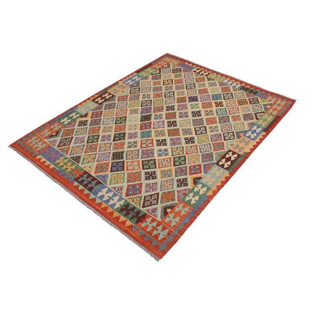 Add a touch of elegance to your home with this casual chic hand woven Tribal Kilim wool rug. Constructed on a loom by...