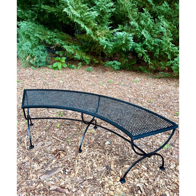 A beautifully restored vintage Salterini style curved wrought iron bench, a sculptural mid-century classic ready for the...