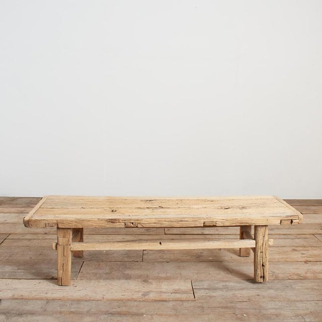 A beautiful vintage solid wooden elm coffee table with some lovely original patina. The weathered plank table top has...