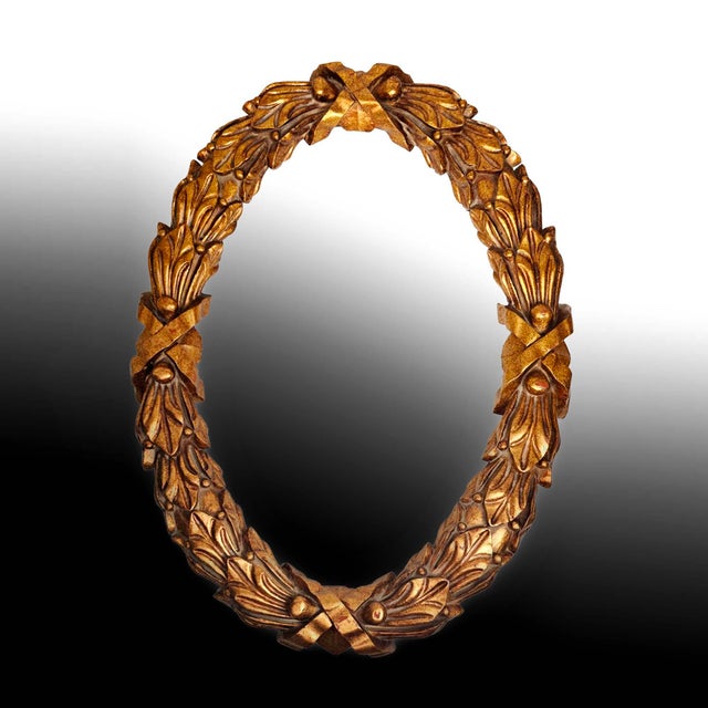 Large 45" Baroque Hand Carved Oval Giltwood Frame (2 available) Baroque carved and gilded wooden frame. The oval form is...