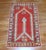 An early 20th century antique Oushak rug with an icy blue prayer niche motif on a red colored ground. Measures: 2'8'' x...