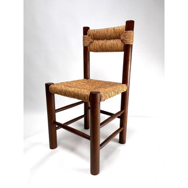 Charlotte Perriand Dining Chairs (Attr.), France 1960s, Set of 4 Extraordinary set of 5 wooden and straw chairs designed...