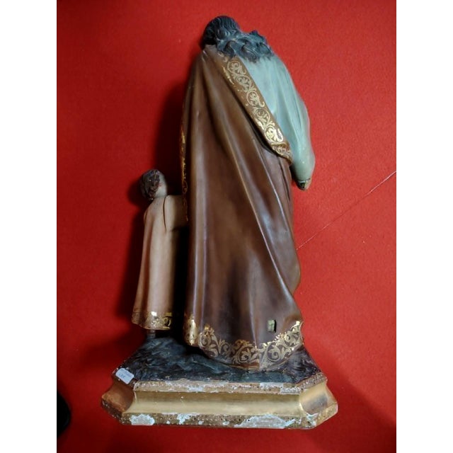 Large Religious Statue of Saint Joseph and the Baby Jesus in Polychrome Terracotta and Gilded Wood, in Good conditions....