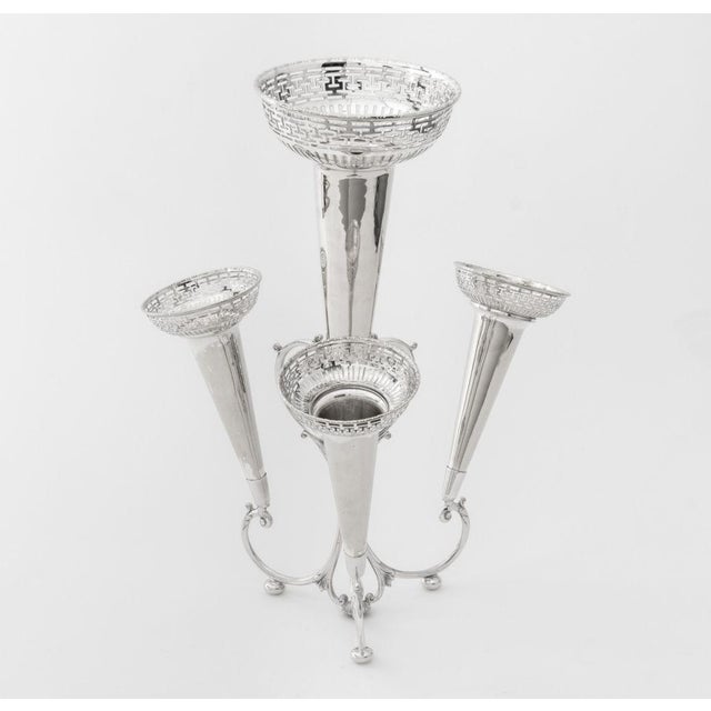 Silver Plate Four Trumpet Epergne, the trumpets with pierced geometric rim mounted on scroll form base with three arms and...