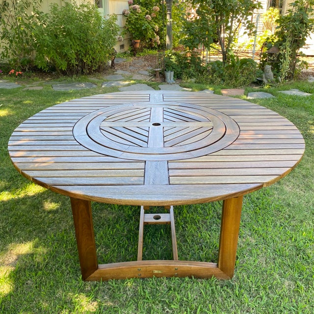 Beautiful gently used outdoor table with a lazy susan round inset. All wood. Round center rotates so you can easily move...