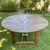 Beautiful gently used outdoor table with a lazy susan round inset. All wood. Round center rotates so you can easily move...