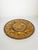An elegant glazed ceramic serving platter designed for oysters. It features twelve individual wells arranged in a circle,...