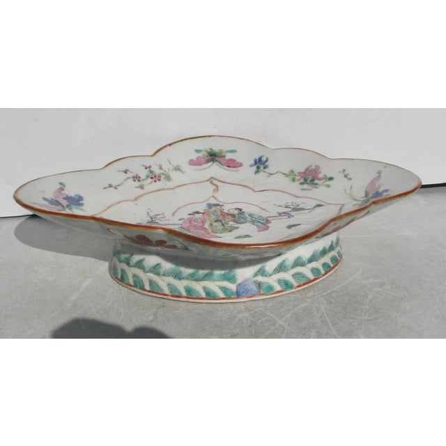 Quatrefoil serving bowl. Chinese, circa the early 19th century, a finely painted central scene with four butterflies and...