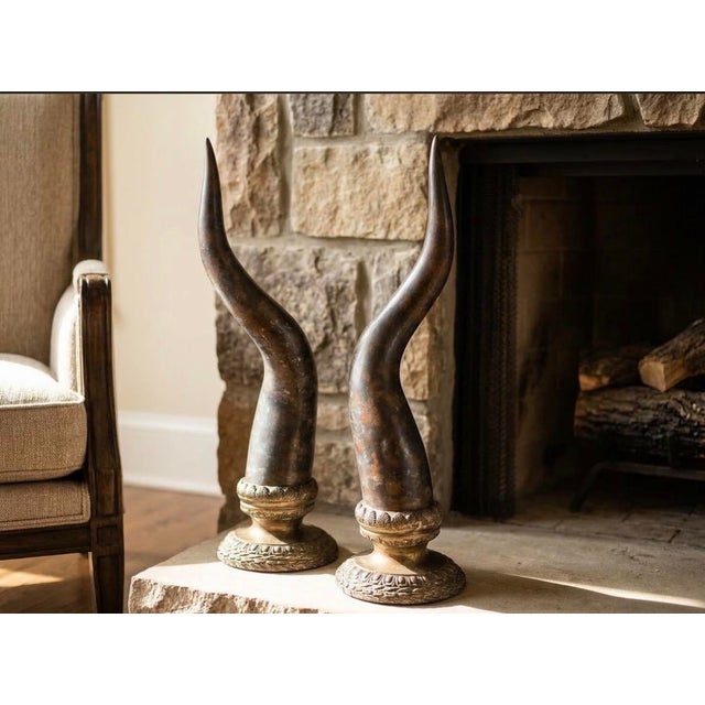 Elevate your mantel, entryway console, or library shelving with this authentic pair of vintage horn sculptures by...
