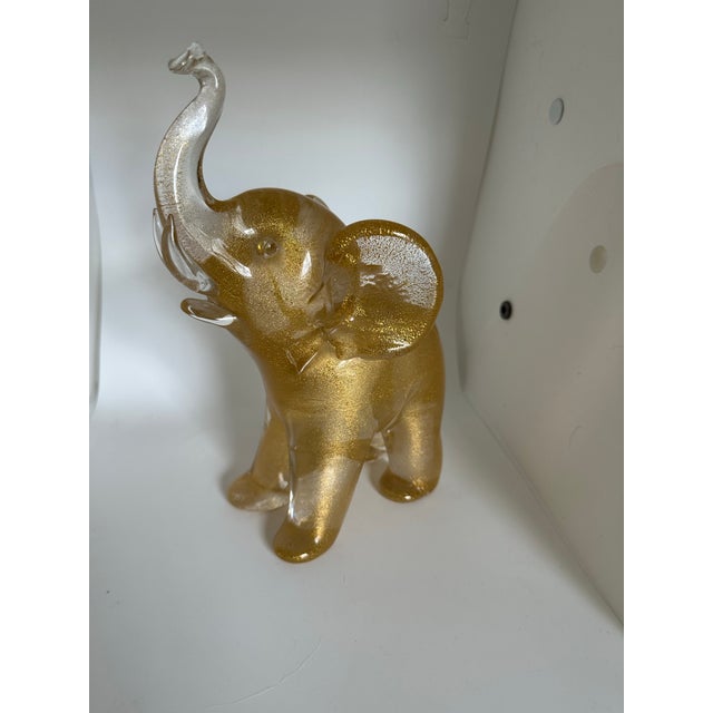 I purchased this in Venice in 1980. Venetian Glass Elephant with Gold Flecks throughout.