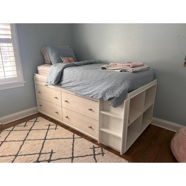This is a 2 1/2 year old twin size West Elm x PB Teen Storage Bed with bookshelf, 4 dresser drawers and a pull-out desk in...