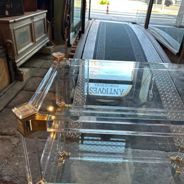 This Italian bar cart by Fratelli Orsenigo is a statement piece that epitomizes the elegance and sophistication of both...