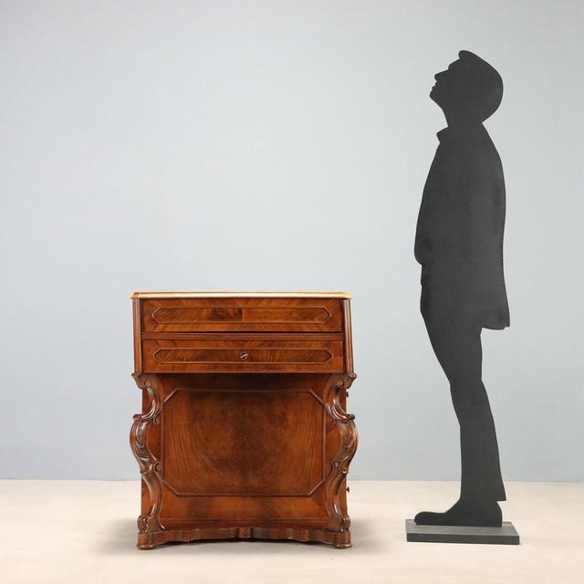 Louis Philippe vanity in walnut and cherry, dated to the second quarter of the 19th century, of Italian craftsmanship. The...