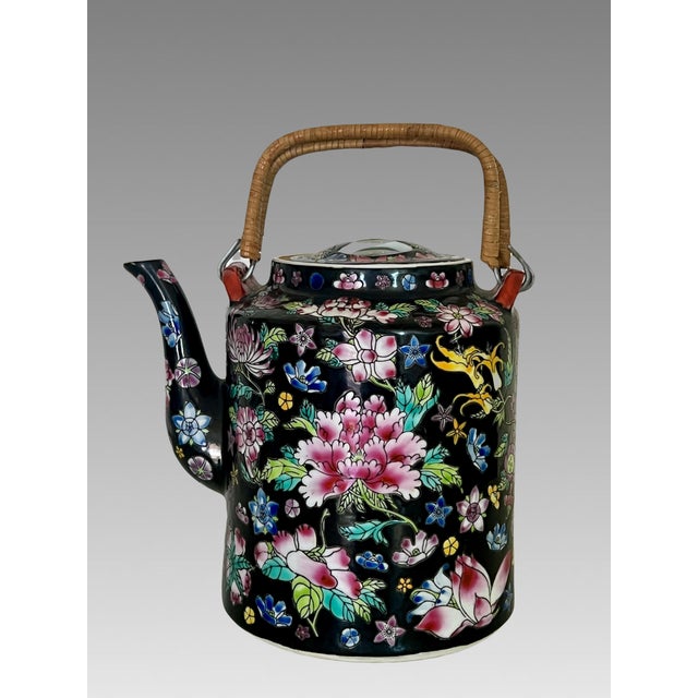 Large vintage Chinese Famille Noire teapot with wrapped natural handles in the Thousands of Flowers pattern on black...