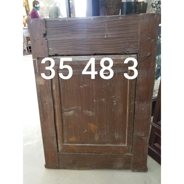 Antique Austrian neoclassical mirror with giltwood and ebony decorative accents.