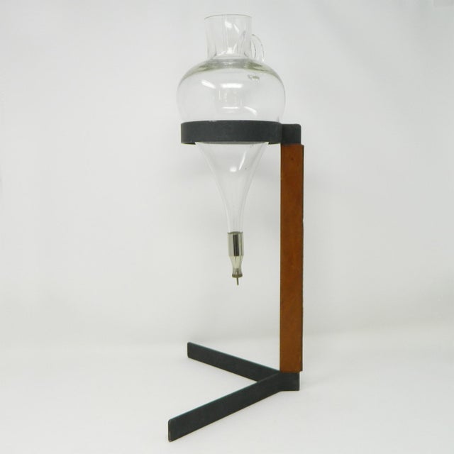 A wine lifter designed by Carl Auböck III for the Auböck workshop in Vienna. It consists of a steel frame partially...