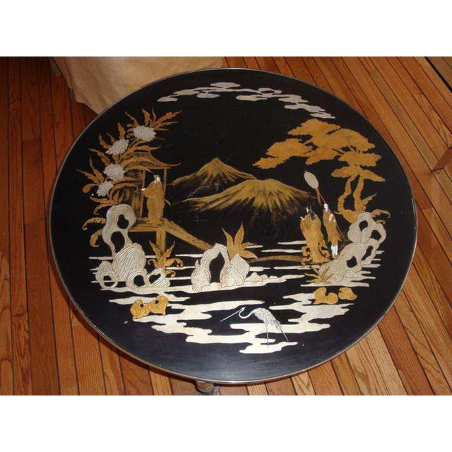 This is a 1970s gold and silver leaf painted Asian inspired round cocktail table. A trouvailles creation was a handmade...