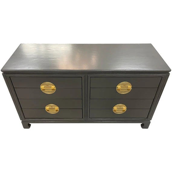 A long, low dresser in a deep charcoal or espresso finish with six drawers arranged in a clean, symmetrical layout. Each...