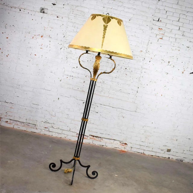 Beautiful monumental sized neoclassical style iron floor lamp with a gilt acanthus leaf design and an enormous parchment...