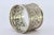 Silver Napkin Ring with Raised Floral Motifs Surrounding a Monogram Card., in Good conditions.