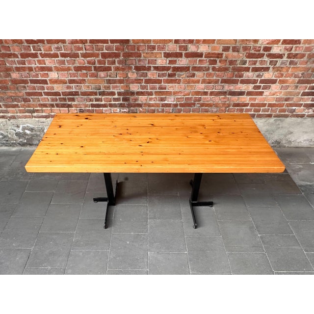 Original Les Arcs dining table designed by Charlotte Perriand and produced in France during the 1960s. This example...