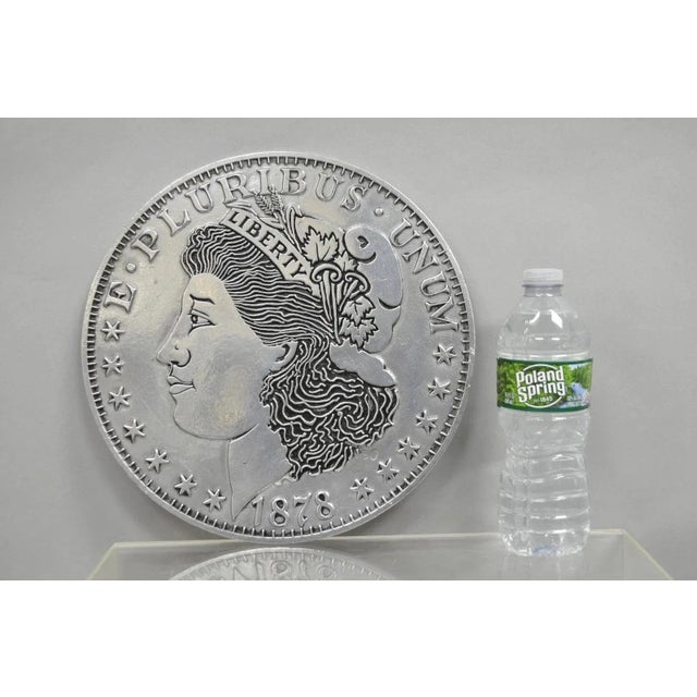Vintage 1878 Morgan Silver Dollar 12" Pewter Trivet or Wall Hanging Plaque, USA. Circa Late 20th Century. Measurements:...