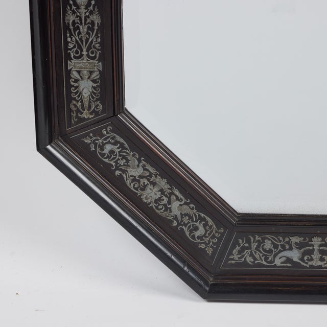 Octagonal, ebonized frame with intricate inlaid steel designs featuring phoenix, dragons, masks and flowers. Beveled...