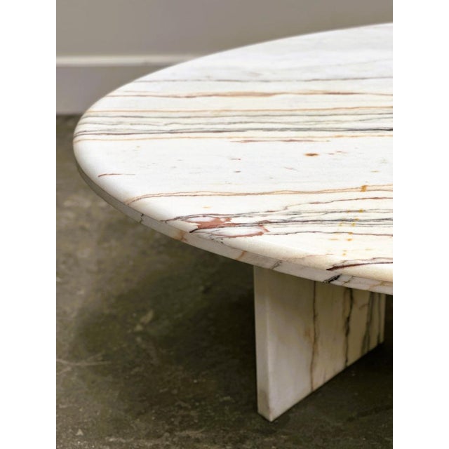 A spectacular large oval marble coffee table crafted in stunning Breccia Sarda Striato, known for its distinctive linear...