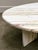 A spectacular large oval marble coffee table crafted in stunning Breccia Sarda Striato, known for its distinctive linear...