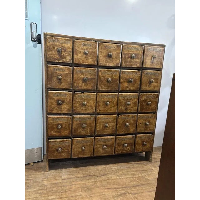 Large Floor Standing Old Pine Bank Of Shop Drawers. 25 Deep Drawers Each drawer with a painted of what was inside. 125.5...