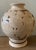 Unique hand-carved vase with separate base in tan and brown tones. Beautiful carved design includes flowers, vines, leaves...