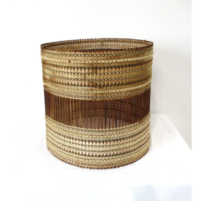 A woven raffia and redwood Mid Century lamp shade by Maris Kipp, each of these handcrafted shades are unique and fit well...