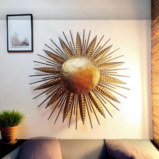 A large vintage gold-toned sunburst wall/ceiling light, broadly dating to the 1950s–1960s. Alternating slender rods and...